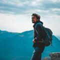 Man enjoying a scenic mountain view in India, capturing the essence of adventure and travel.